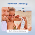 Paar am Strand mit Aloe First Aloe-Vera-Spray, 473 ml
